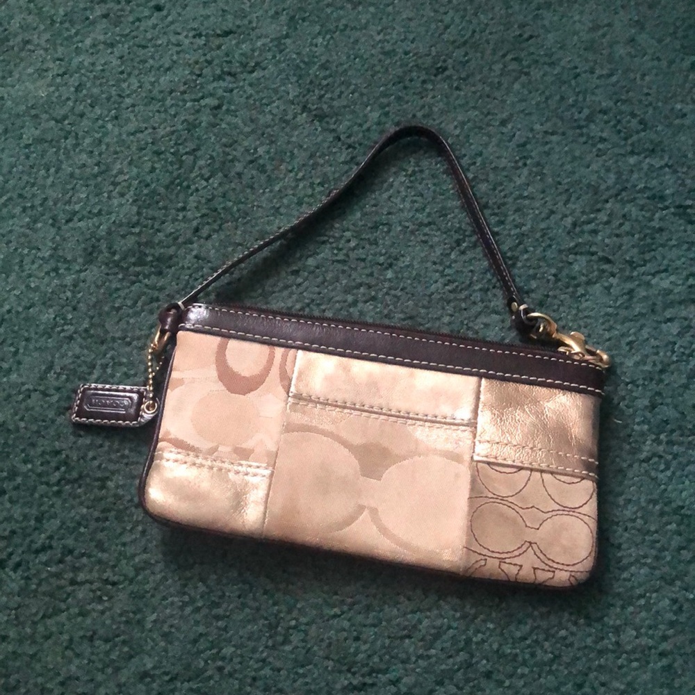 Coach wristlet in gold